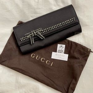 Gucci black satin clutch. Made in Italy. Gray and black crystal embellishment.